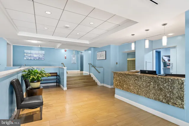 a spacious bedroom with a bed and a couch