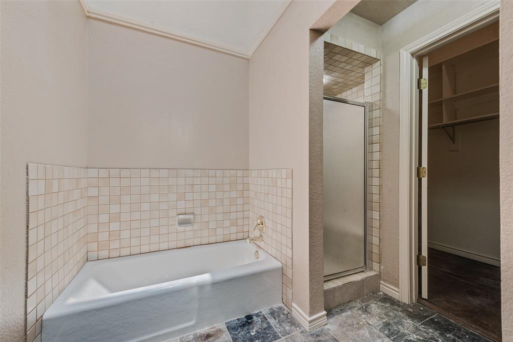 1242 Signal Ridge Place Rockwall, TX 75032 - Photo 21 of 27 a bathroom with bathtub and shower