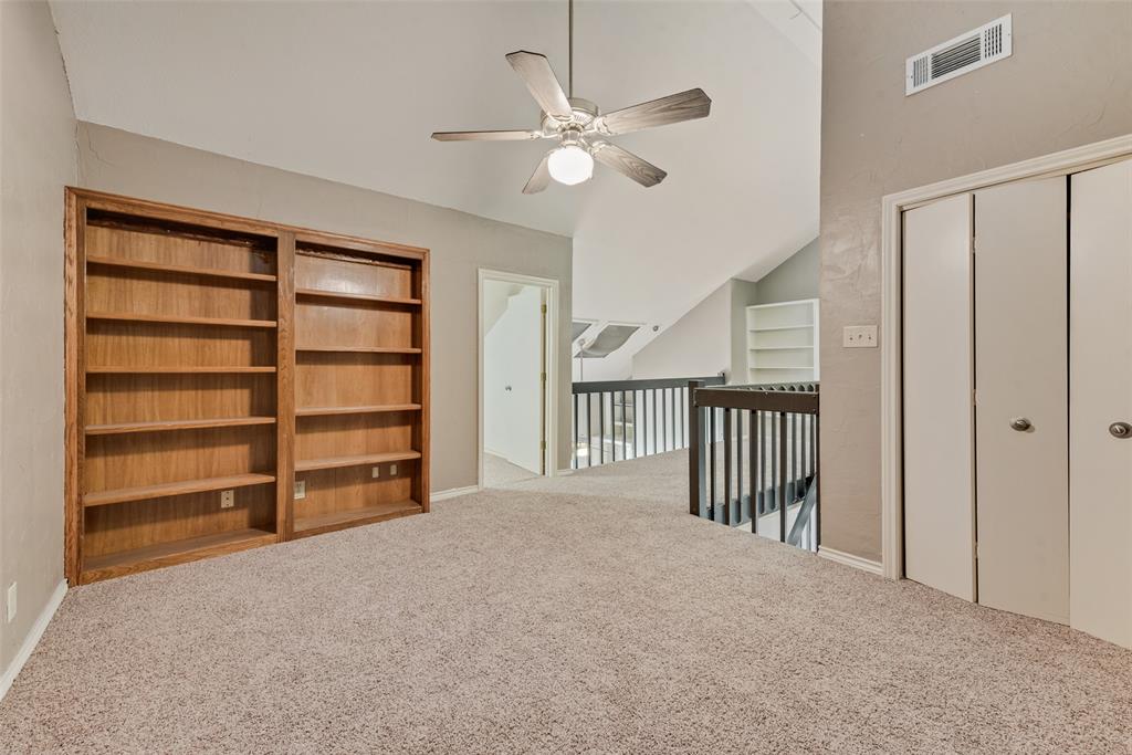 1242 Signal Ridge Place Rockwall, TX 75032 - Photo 10 of 27 a view of a livingroom with a ceiling fan and window