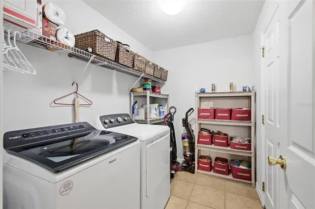 a view of a workspace with furniture and a fireplace