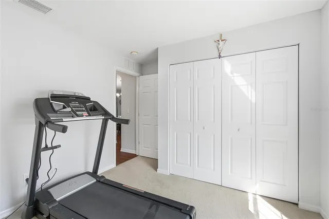 a bedroom with a bed and a view of bathroom