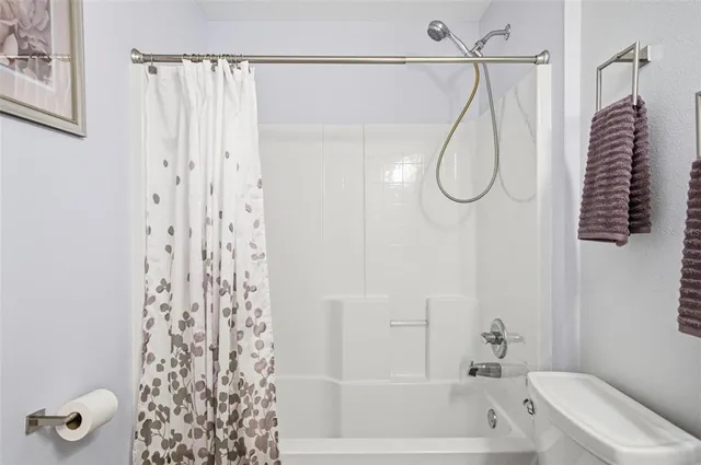 a bedroom with a bed and dresser