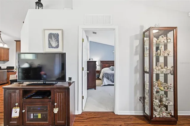 a view of walk in closet with clothes