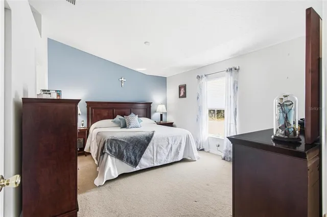 a bathroom with a sink mirror and toilet
