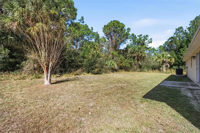 an aerial view of a house with outdoor space