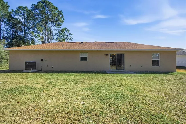 an aerial view of a house with swimming pool
