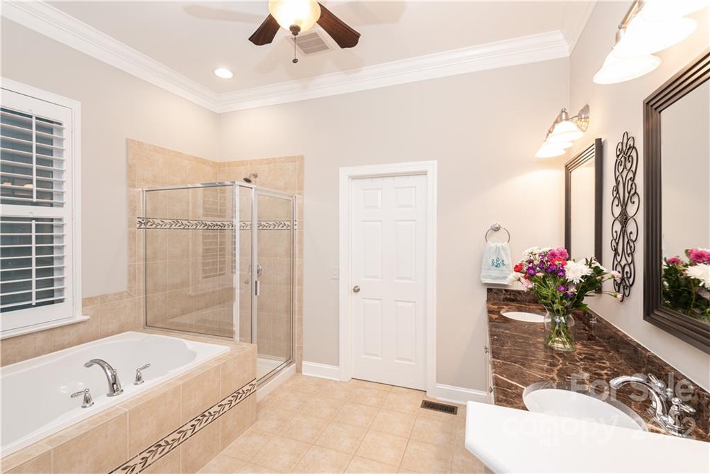 930 Stratford Run Drive Fort Mill, SC 29708 - Photo 11 of 28 a bath room with a bathtub and a shower