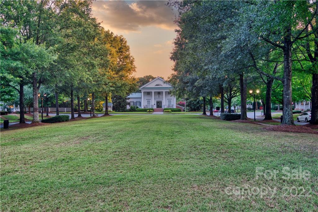 930 Stratford Run Drive Fort Mill, SC 29708 - Photo 27 of 28 a view of a yard with a house in the background