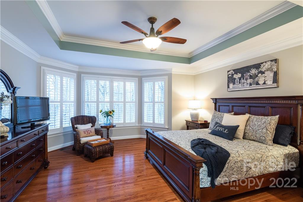 930 Stratford Run Drive Fort Mill, SC 29708 - Photo 10 of 28 a bedroom with a bed and wooden floor