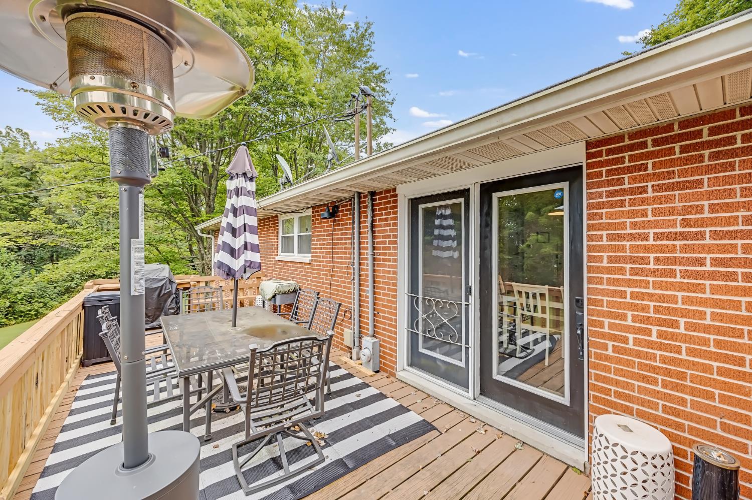 16099 Shays Road Brookville, IN 47012 - Photo 6 of 56 “A large deck overlooks the spacious backyard, offering the perfect spot for relaxing or entertaining.”
