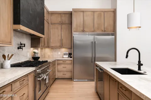 a kitchen with lots of counter space and wooden floor