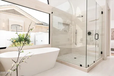 a bathroom with a double vanity sink mirror double and shower
