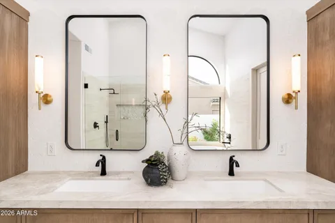 a dining room with wooden floor and white walls