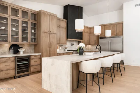 a kitchen with a sink cabinets and window
