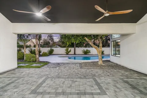 a view of a swimming pool with a yard