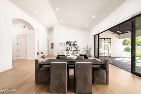 a large kitchen with a table and chairs