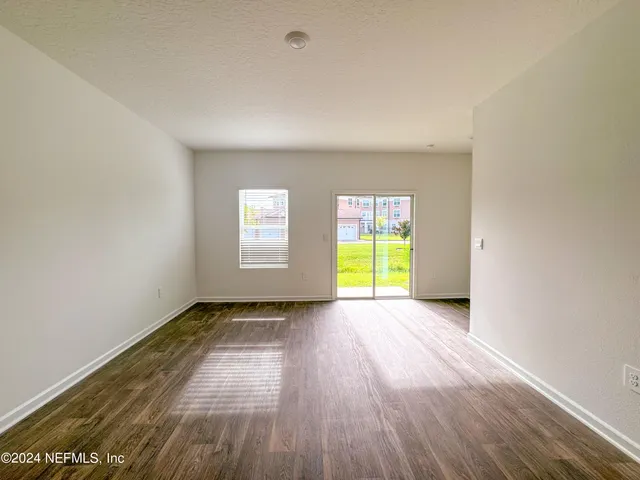 a kitchen with a sink stove and microwave