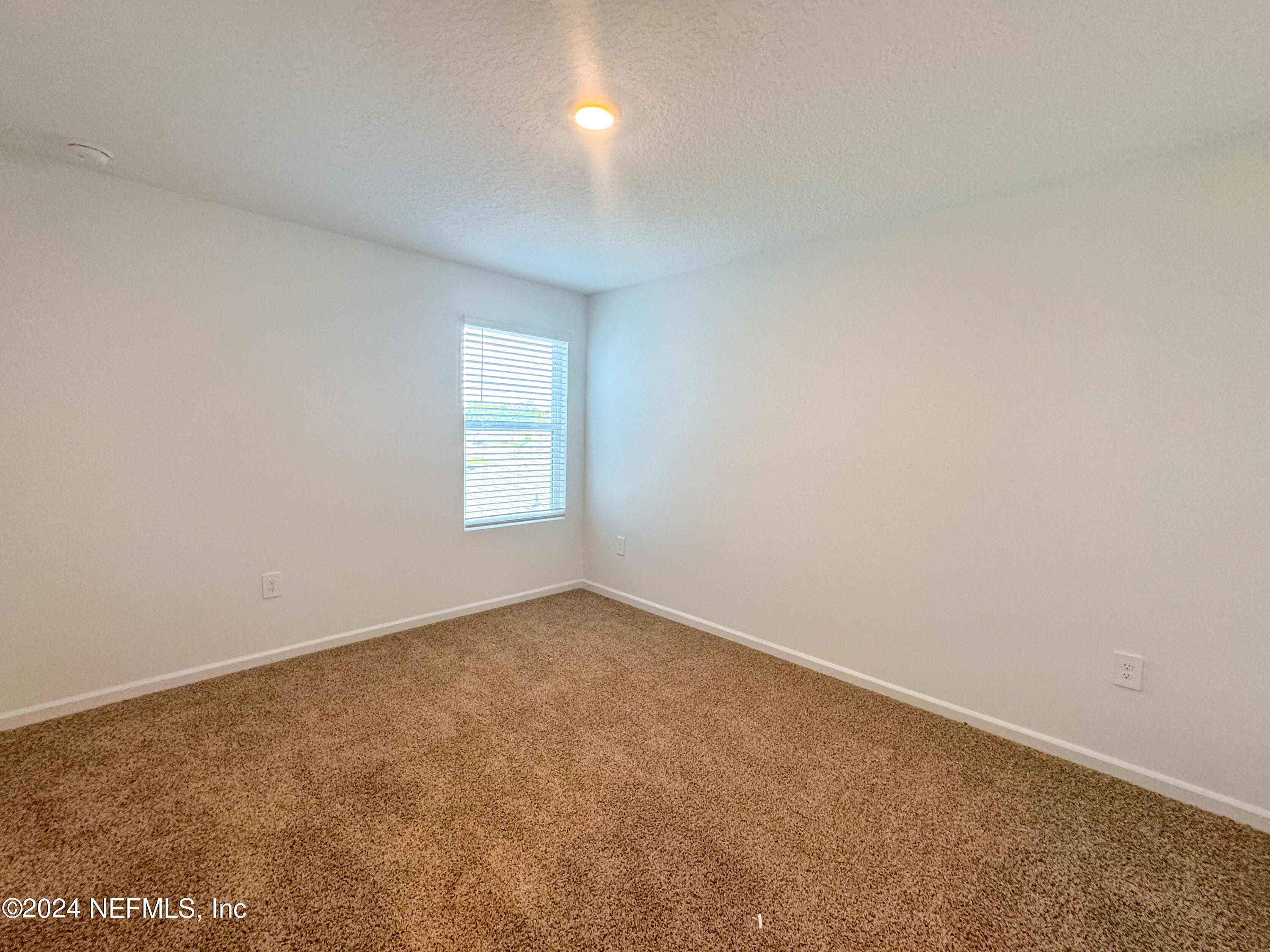 1633 Bridger Trace Middleburg, FL 32068 - Photo 19 of 26 an empty room with a window