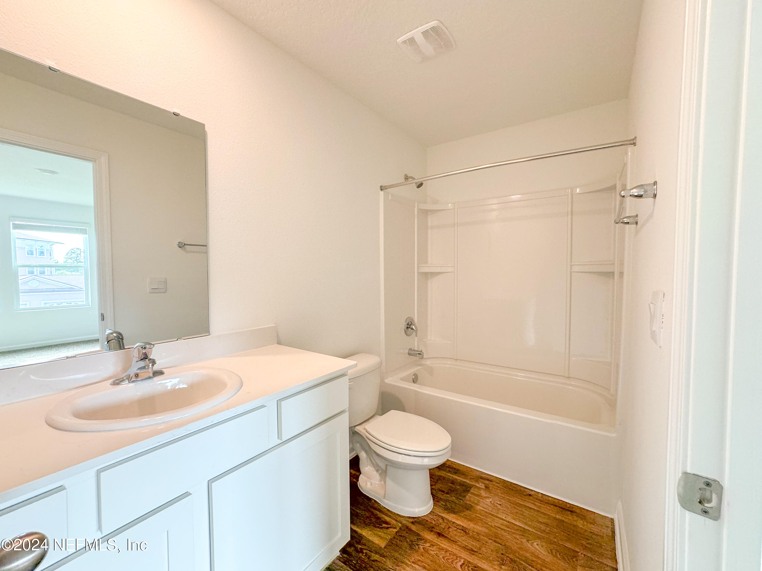 1633 Bridger Trace Middleburg, FL 32068 - Photo 20 of 26 a bathroom with a sink toilet and shower