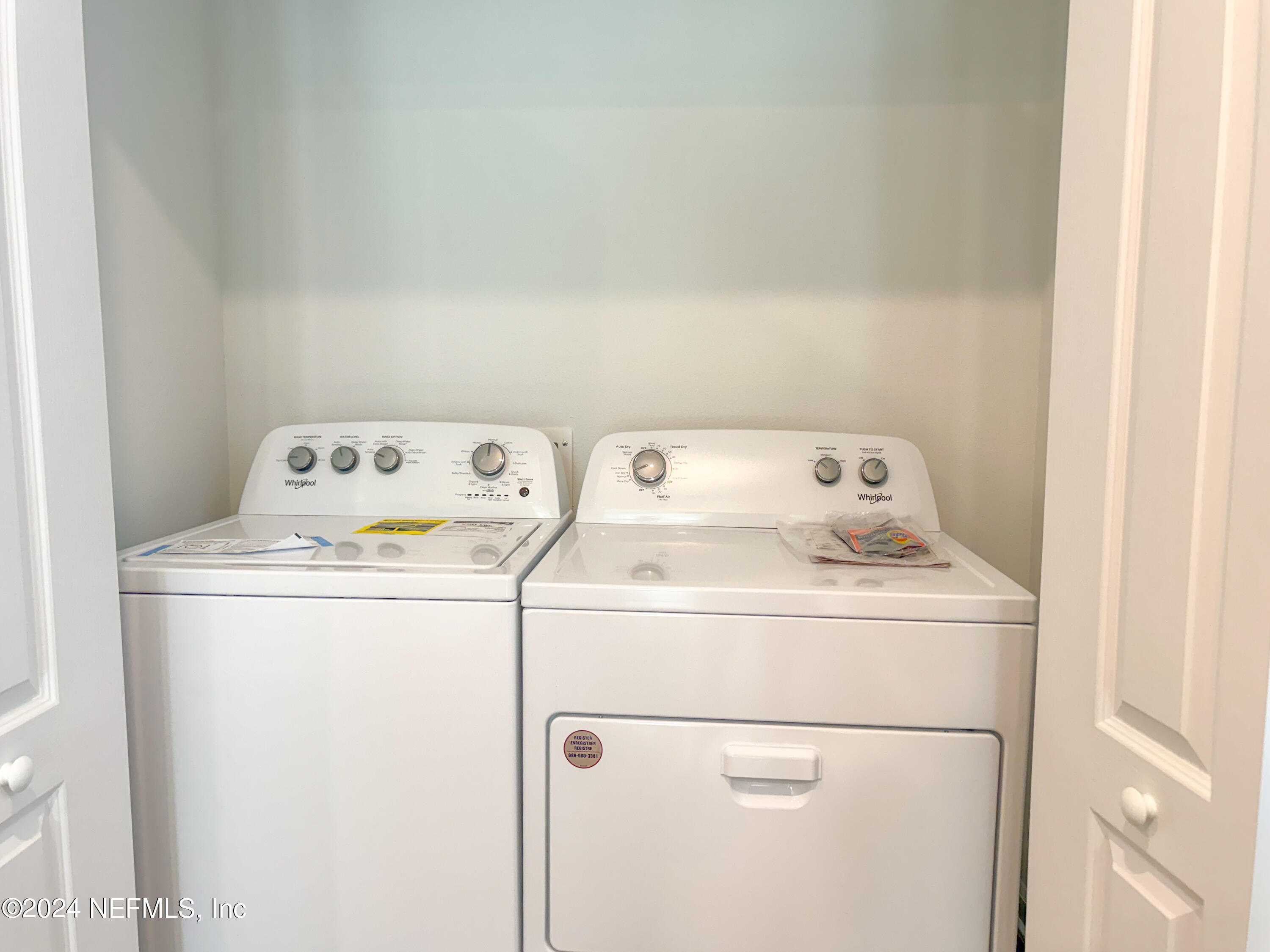 1633 Bridger Trace Middleburg, FL 32068 - Photo 23 of 26 a utility room with dryer and washer