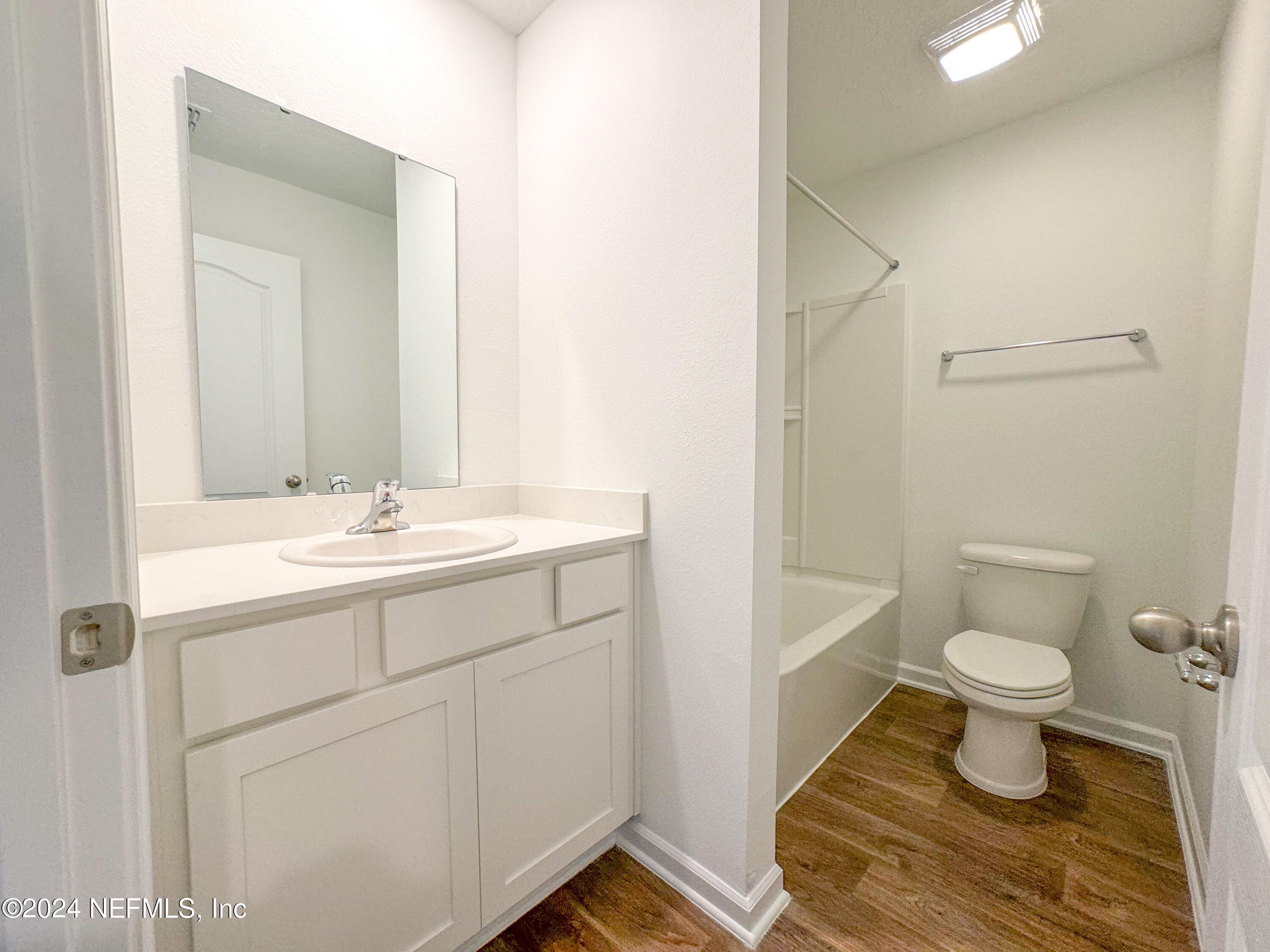 1633 Bridger Trace Middleburg, FL 32068 - Photo 24 of 26 a bathroom with a sink toilet a mirror and shower