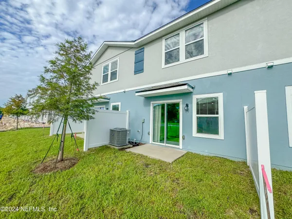 a bathroom with a sink toilet a mirror and shower