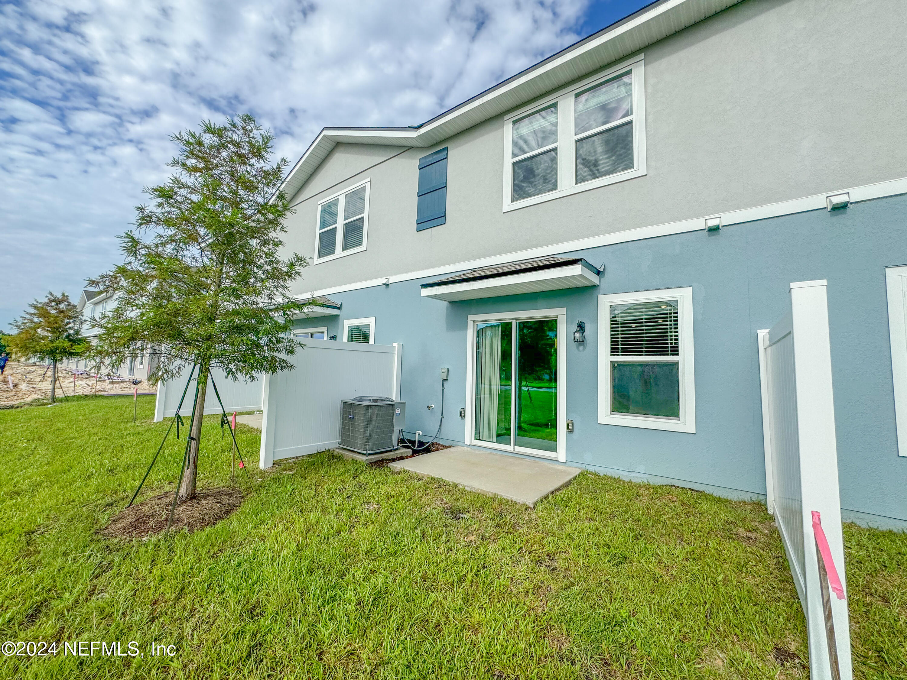 1633 Bridger Trace Middleburg, FL 32068 - Photo 25 of 26 a view of an house with backyard and a tree