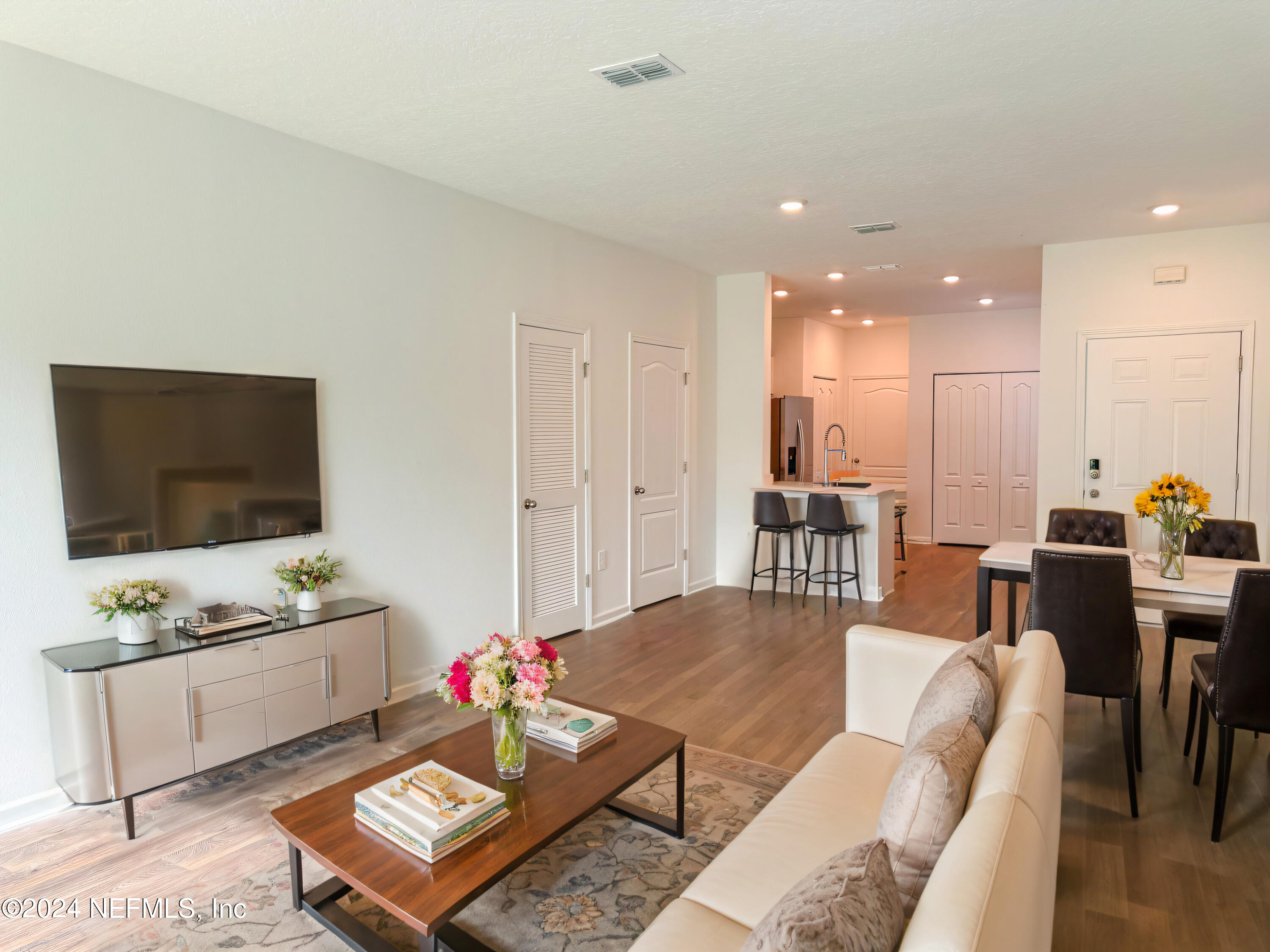 1633 Bridger Trace Middleburg, FL 32068 - Photo 4 of 26 a living room with furniture and a flat screen tv