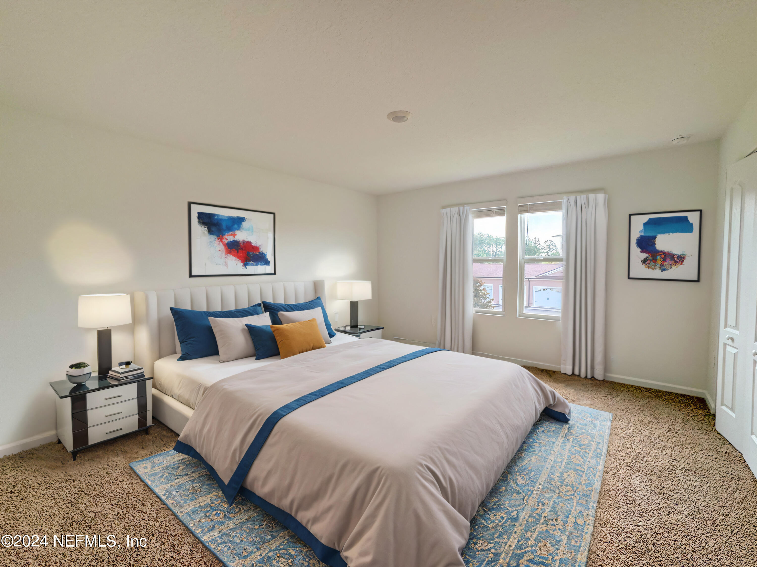 1633 Bridger Trace Middleburg, FL 32068 - Photo 5 of 26 a bedroom with a bed and a couch