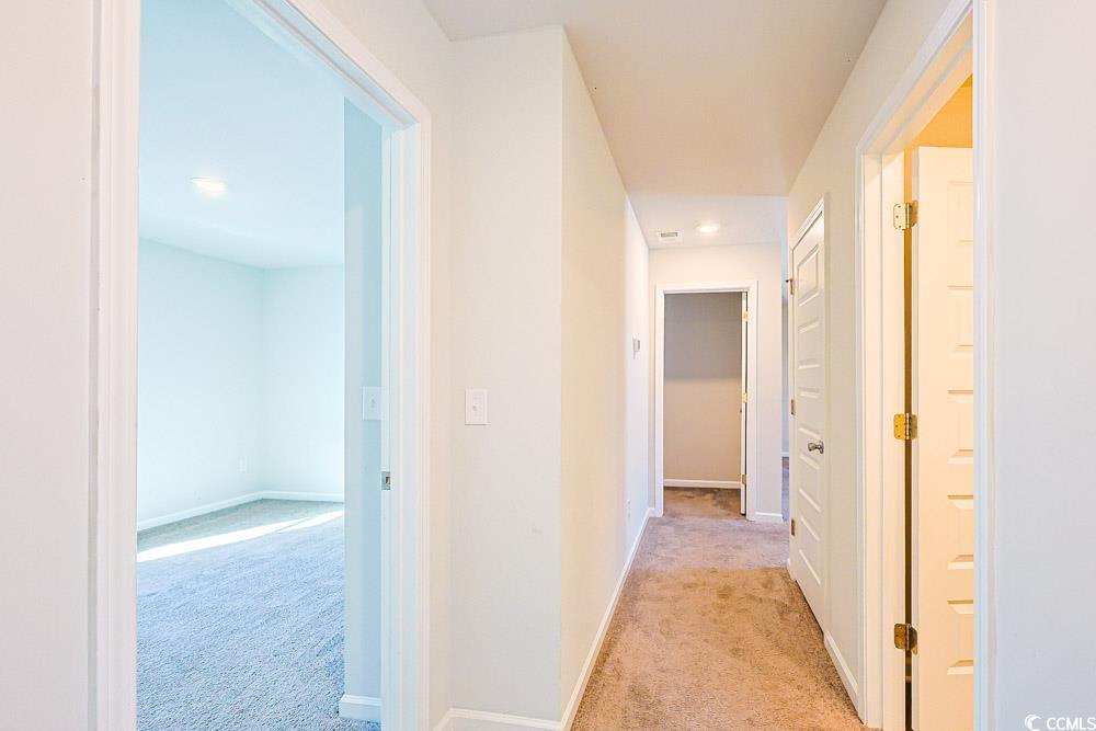 1560 Swing Bridge Way Myrtle Beach, SC 29588 - Photo 21 of 35 Hall with light carpet and recessed lighting