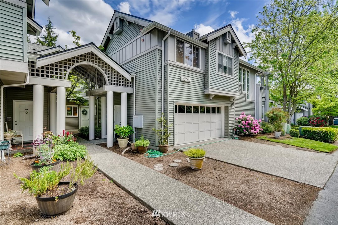22715 4th Avenue West, Unit 104 Bothell, WA 98021 - Photo 1 of 27 a front view of a house