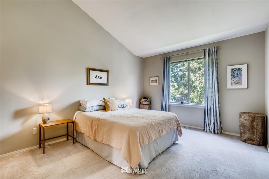 22715 4th Avenue West, Unit 104 Bothell, WA 98021 - Photo 13 of 27 a bedroom with a bed and a lamp