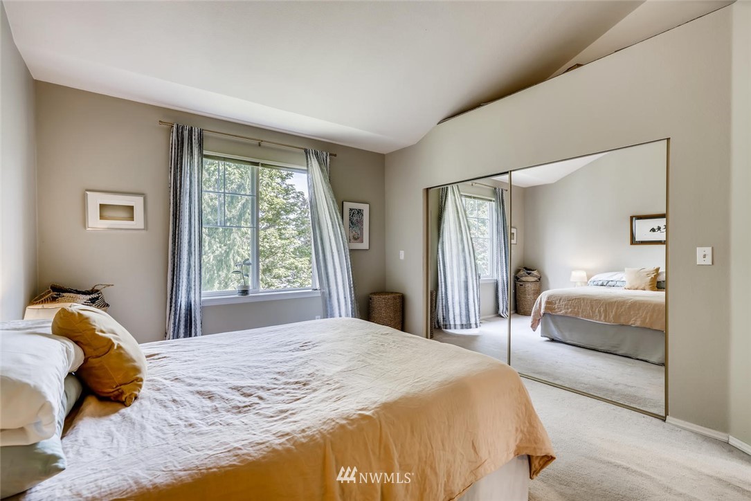 22715 4th Avenue West, Unit 104 Bothell, WA 98021 - Photo 14 of 27 a bedroom with a large bed and a large window