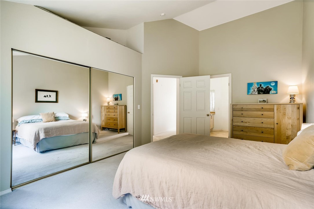 22715 4th Avenue West, Unit 104 Bothell, WA 98021 - Photo 15 of 27 a bedroom with a bed and dresser