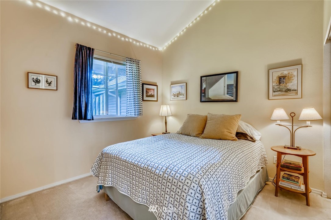 22715 4th Avenue West, Unit 104 Bothell, WA 98021 - Photo 17 of 27 a bedroom with bed and a window