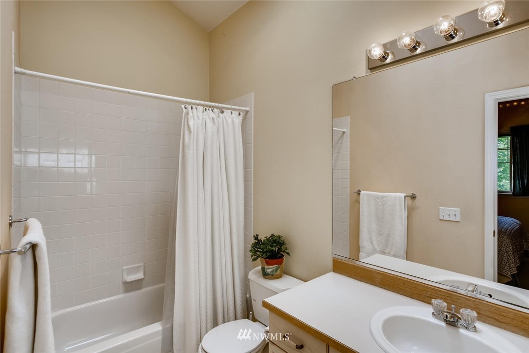 22715 4th Avenue West, Unit 104 Bothell, WA 98021 - Photo 19 of 27 a bathroom with a sink and a mirror