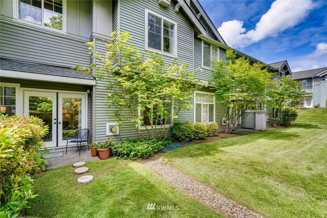 22715 4th Avenue West, Unit 104 Bothell, WA 98021 - Photo 23 of 27 a backyard of a house with garden and plants
