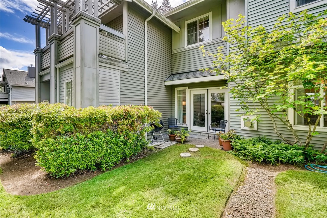 22715 4th Avenue West, Unit 104 Bothell, WA 98021 - Photo 24 of 27 a front view of a house with garden