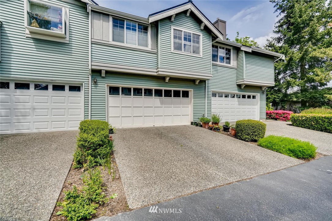 22715 4th Avenue West, Unit 104 Bothell, WA 98021 - Photo 25 of 27 a front view of a house with garden