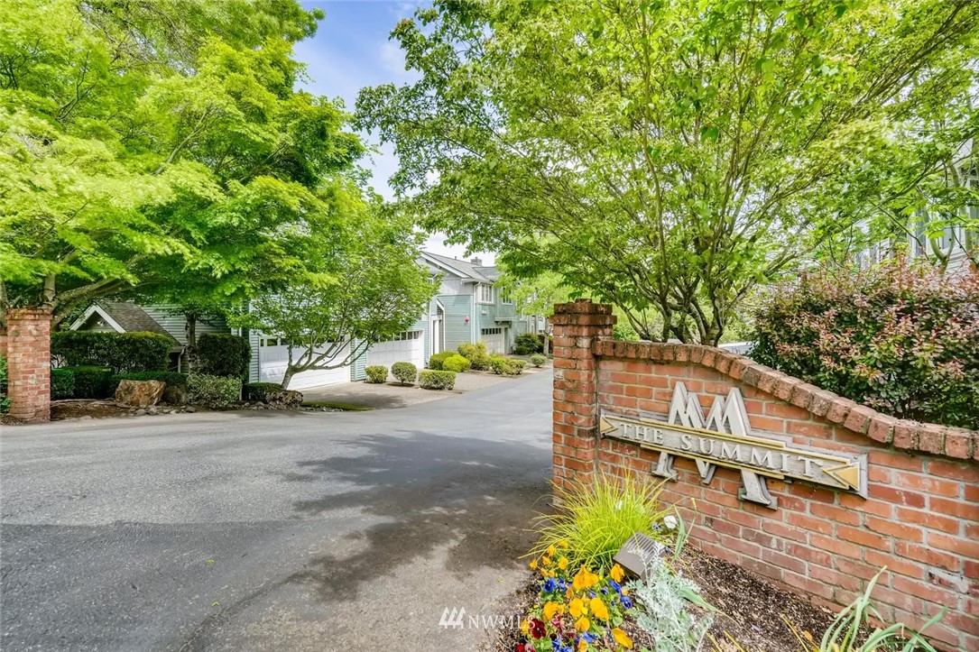 22715 4th Avenue West, Unit 104 Bothell, WA 98021 - Photo 27 of 27 a view of a street with potted plants and large trees