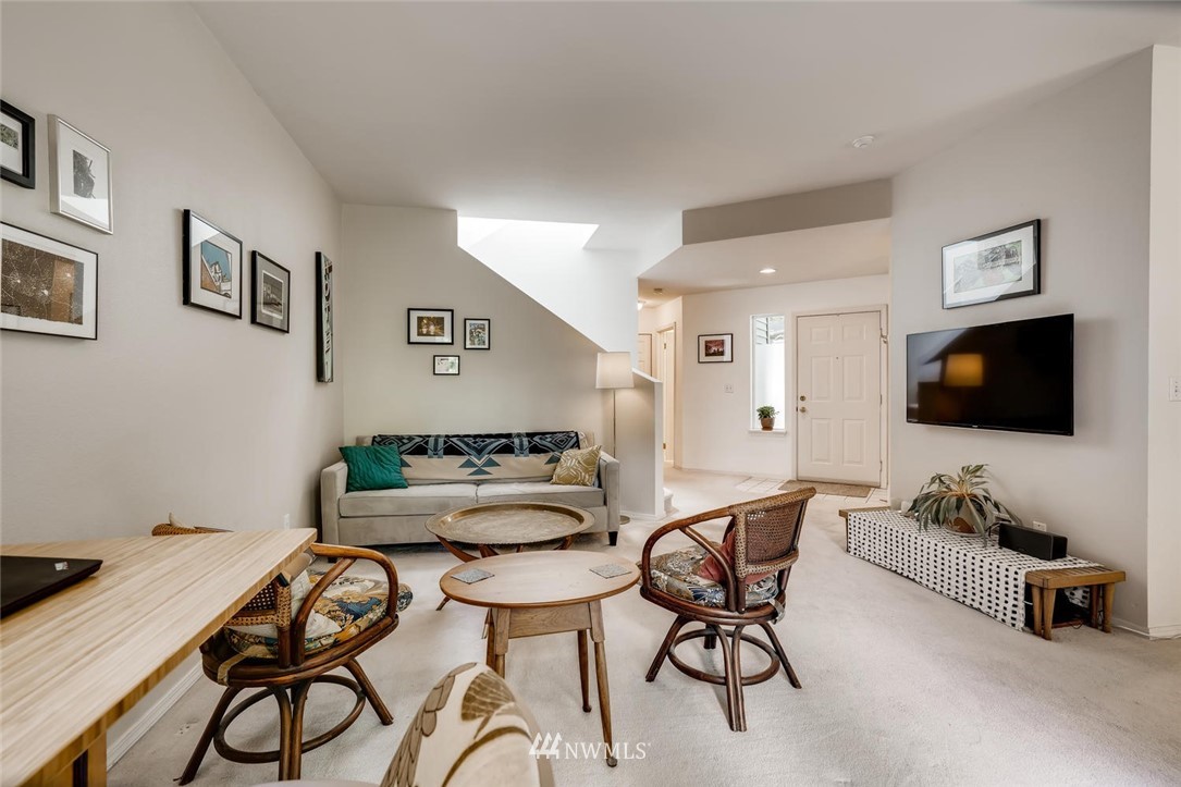 22715 4th Avenue West, Unit 104 Bothell, WA 98021 - Photo 6 of 27 a living room with furniture and a flat screen tv