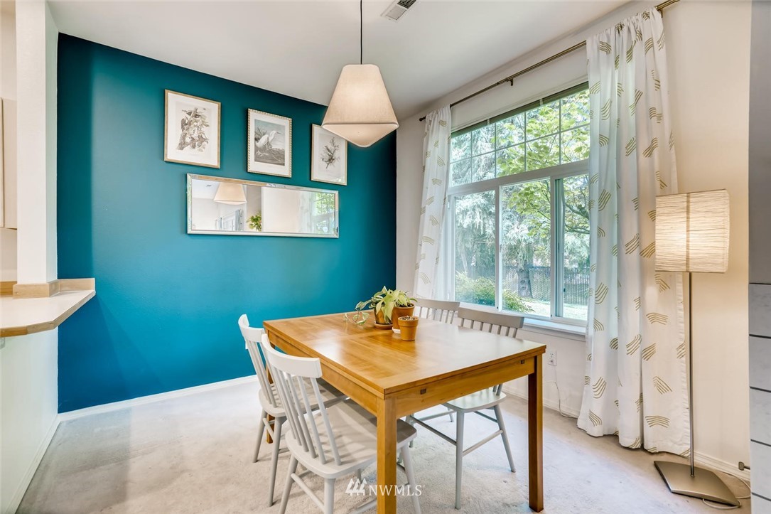 22715 4th Avenue West, Unit 104 Bothell, WA 98021 - Photo 7 of 27 a dining room with a table and chairs