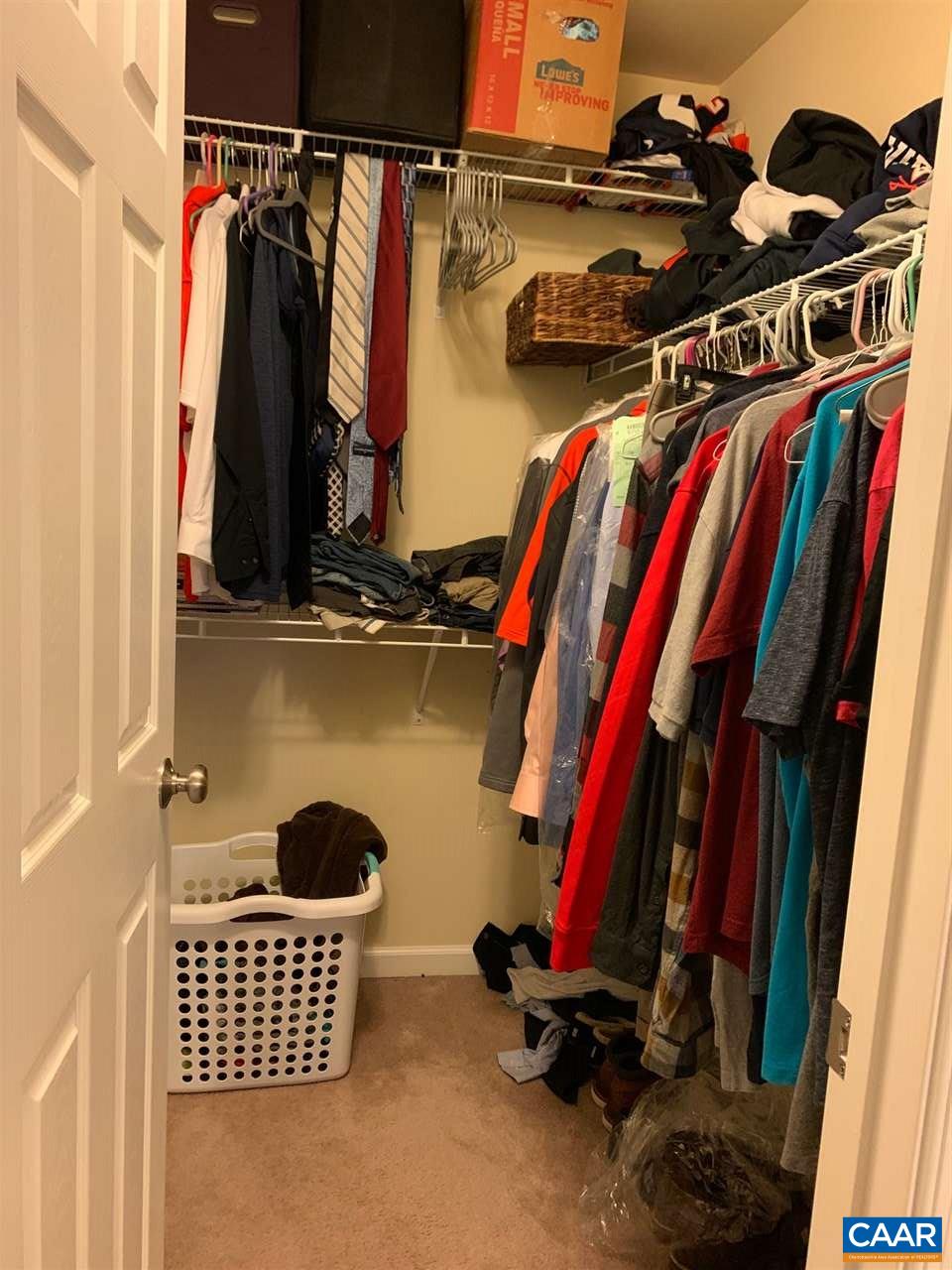 2452 North Berkshire Road Charlottesville, VA 22901 - Photo 21 of 24 a view of walk in closet with clothes and shoes