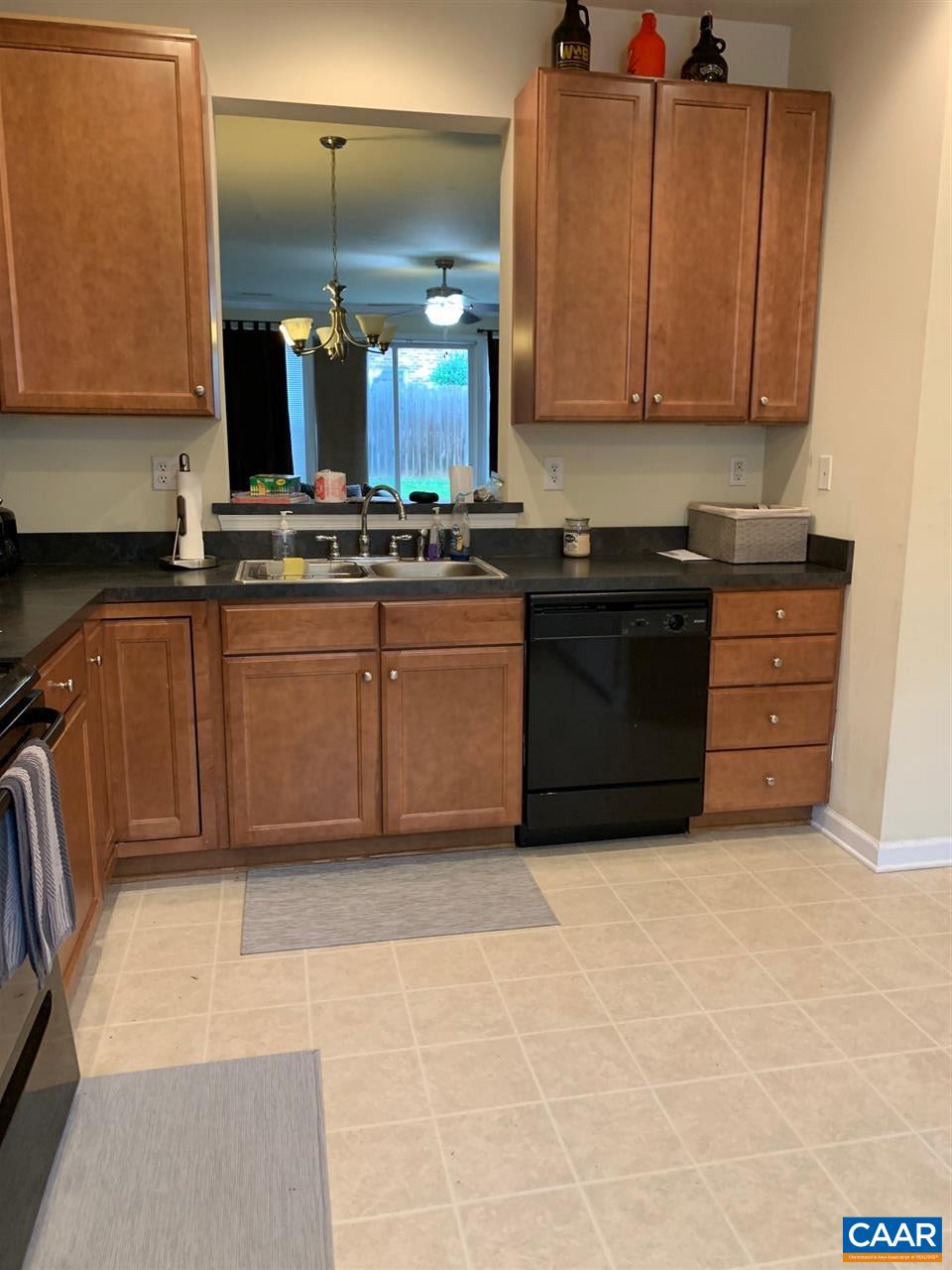 2452 North Berkshire Road Charlottesville, VA 22901 - Photo 3 of 24 a kitchen with stainless steel appliances granite countertop a stove a sink and a microwave