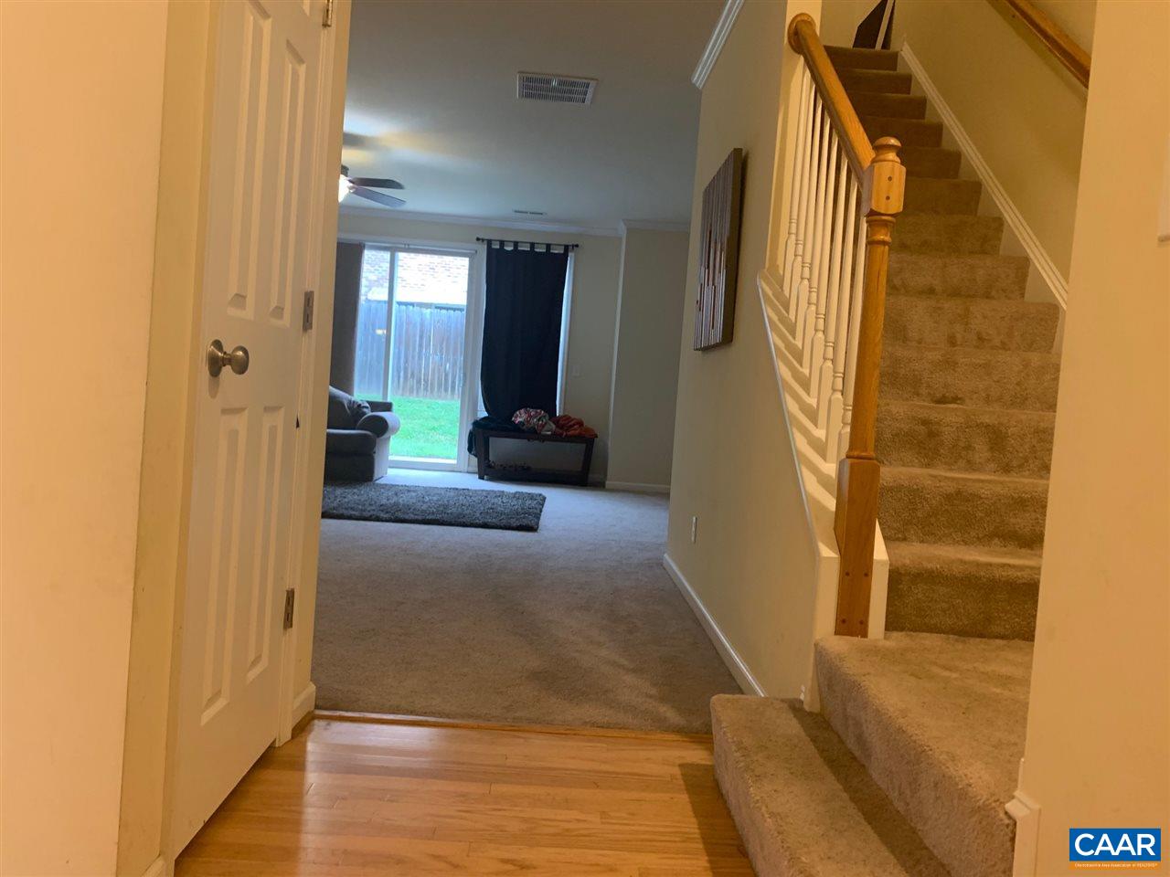 2452 North Berkshire Road Charlottesville, VA 22901 - Photo 6 of 24 a view of a hallway with wooden floor and staircase