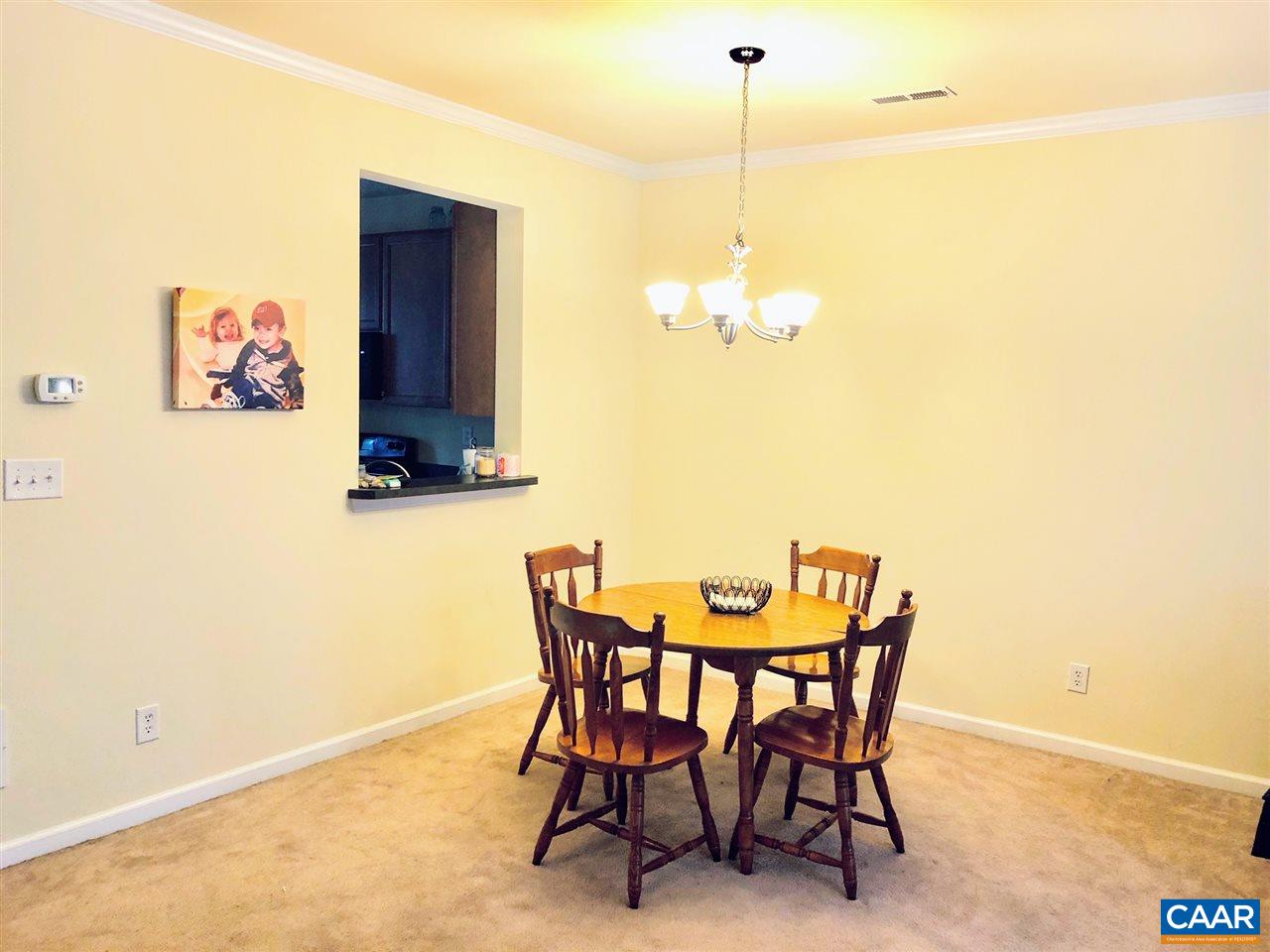 2452 North Berkshire Road Charlottesville, VA 22901 - Photo 10 of 24 a view of a dining room with furniture and chandelier