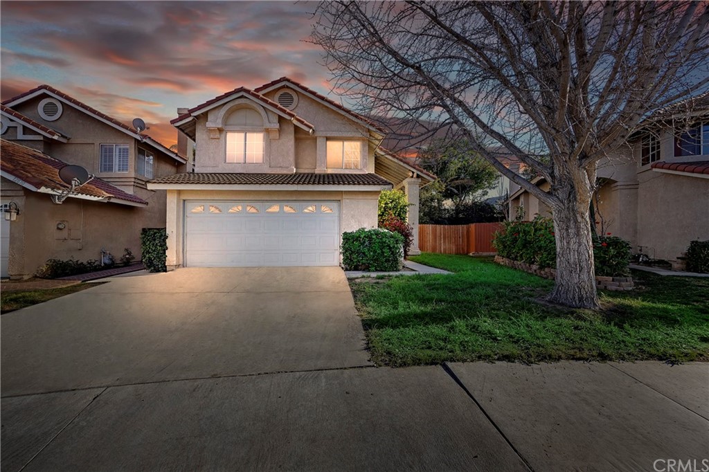 12876 Mayflower Court Riverside, CA 92503 - Photo 1 of 1 a front view of a house with a yard and garage