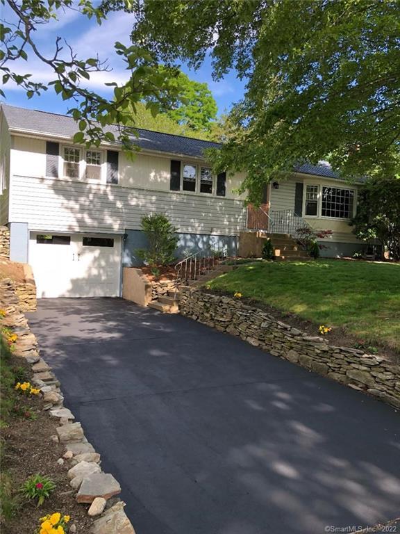 92 Noank Ledyard Road Groton, CT 06355 - Photo 1 of 1 a front view of a house with a garden