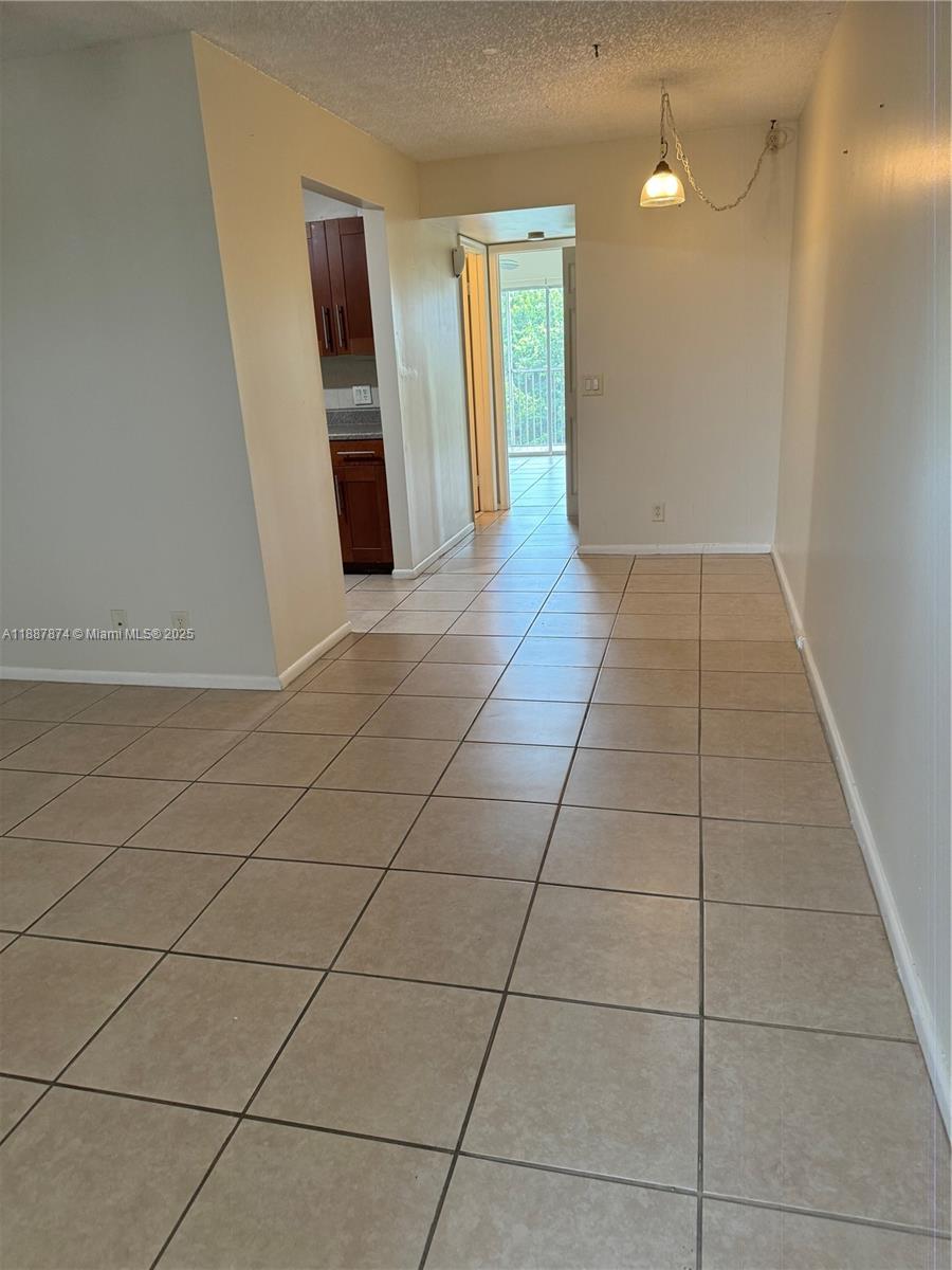 13550 Southwest 6th Court, Unit 409A Pembroke Pines, FL 33027 - Photo 14 of 20 a view of hallway with stairs