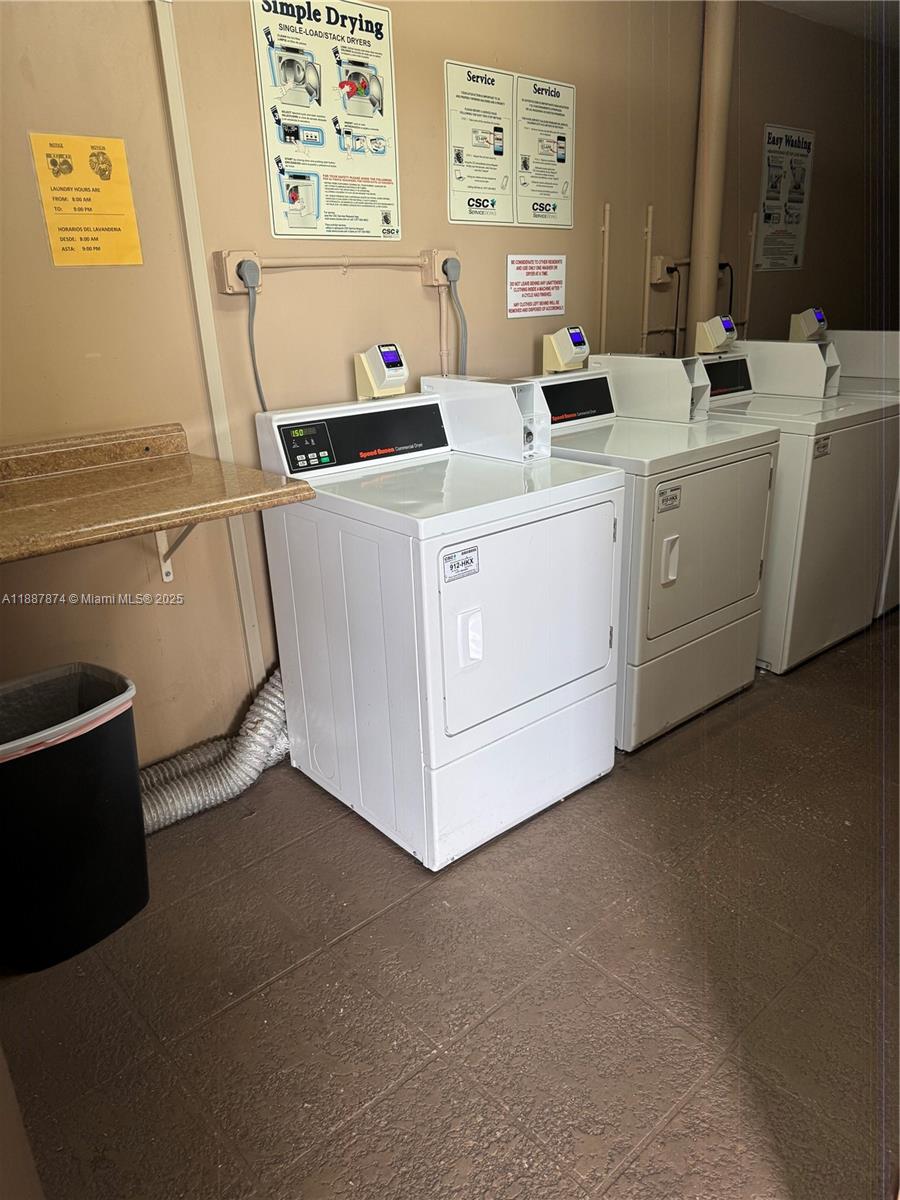 13550 Southwest 6th Court, Unit 409A Pembroke Pines, FL 33027 - Photo 15 of 20 a utility room with dryer and washer